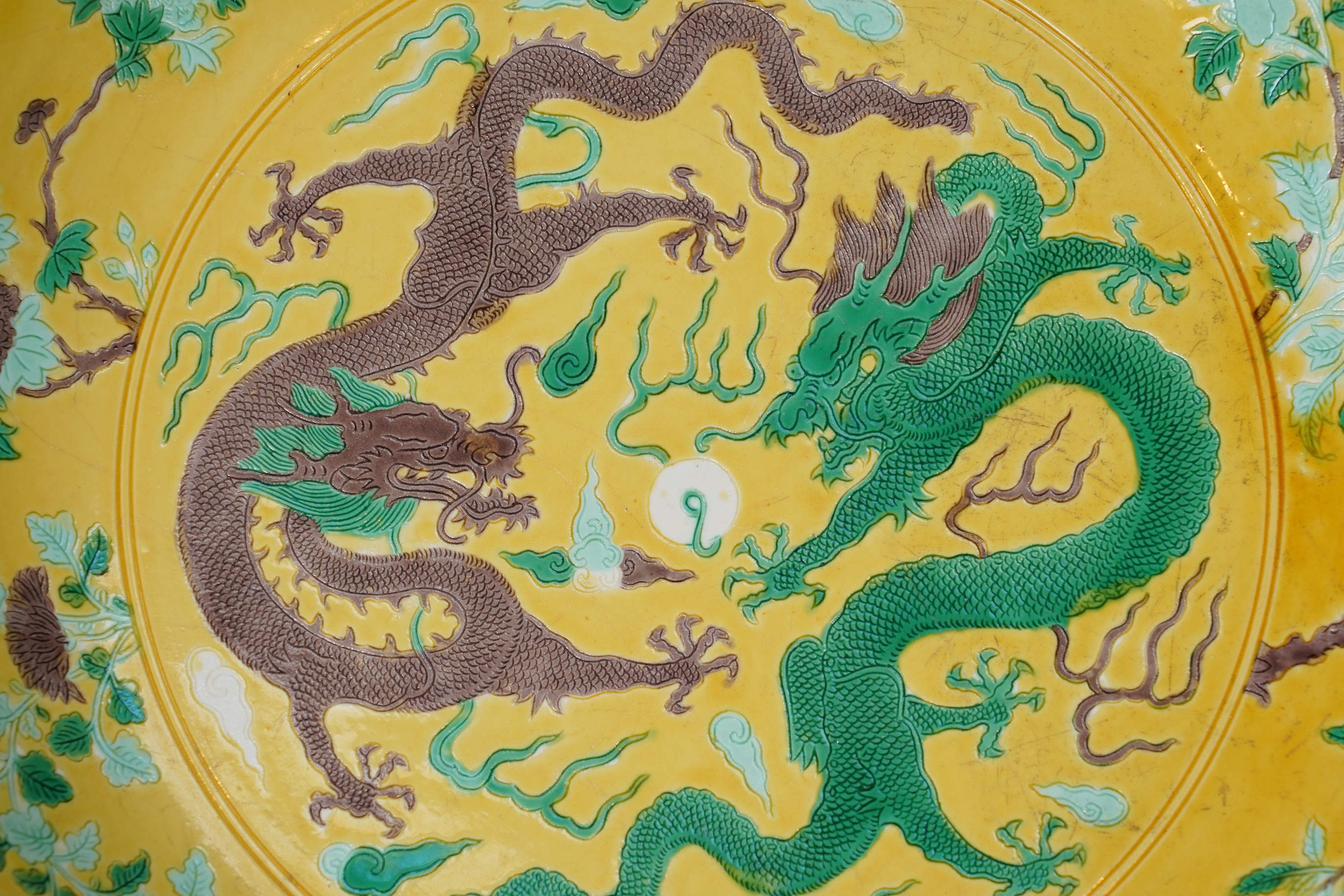 A Chinese yellow, green and aubergine glazed and incised ‘dragon’ dish, chuxiugong zhi hall mark, possibly Guangxu period